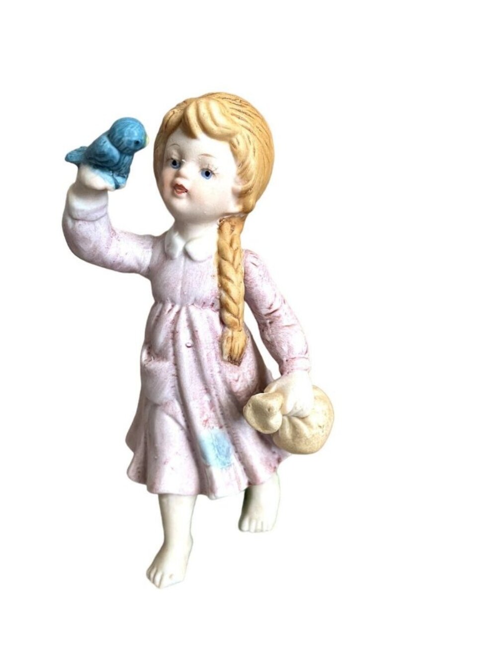 Enesco porcelain little girl sitting on a log holding bluebird 1979